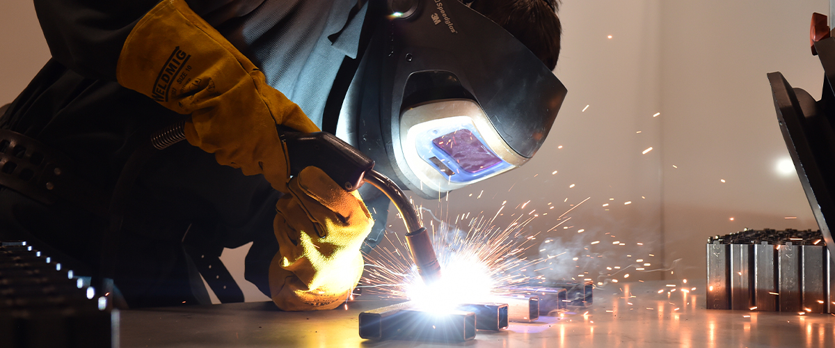 person welding metal components